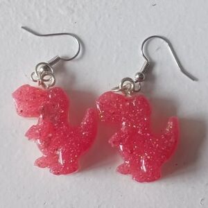 Pink glittery dinosaur earrings